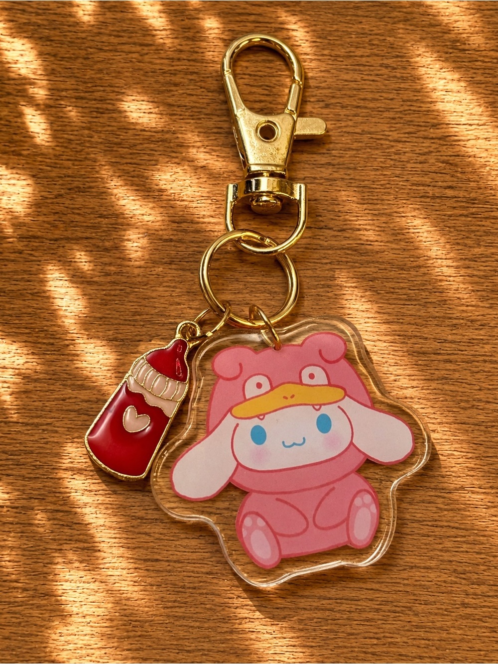 3/$25 Handmade Hello Kitty Cinnamon Role as Duck inspired keychain/bag charm